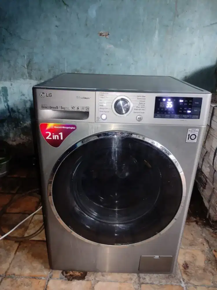 Mesin cuci front loading LG 9 Kg wash and dry