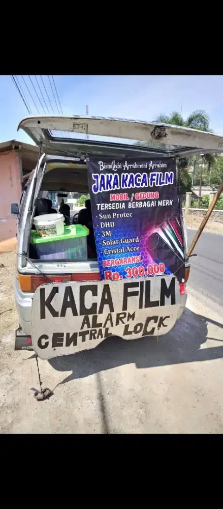 Kaca film mobi dan gedung 24 jam