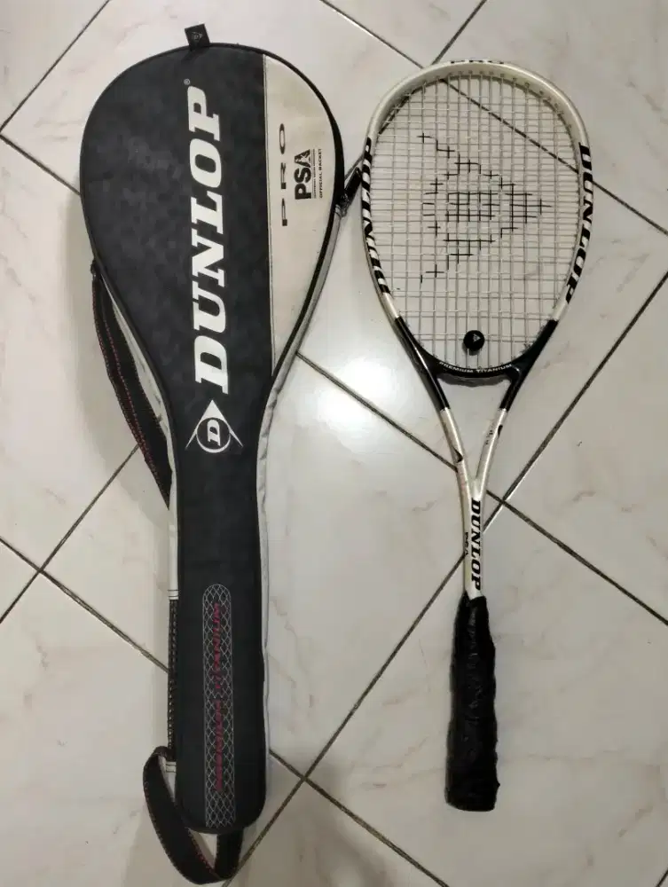 Raket tenis dunlop muscle wave plus sarung