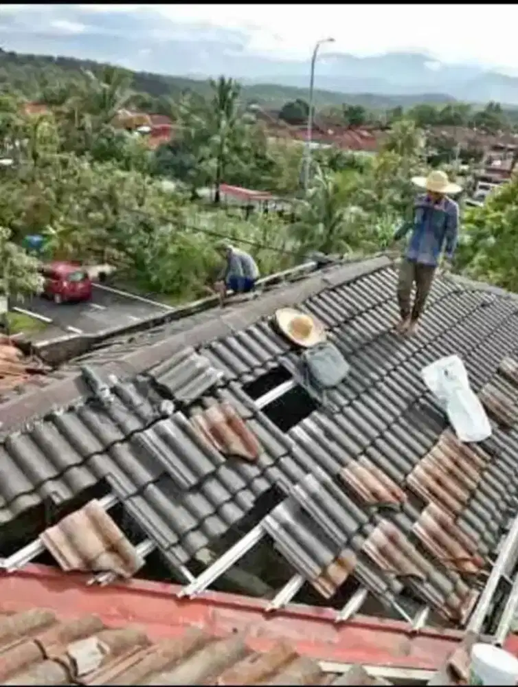 Perbaikan atap bocor talang air dak rembes