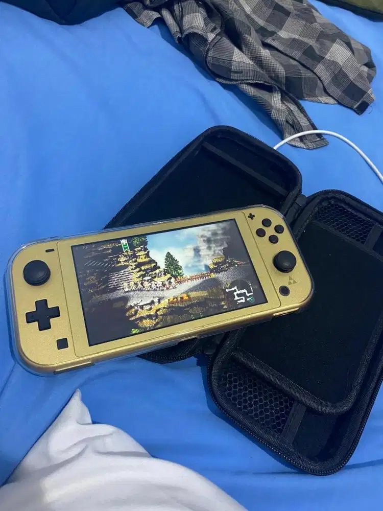 Nintendo Switch Lite Zelda Edition plus kaset Octopath 0