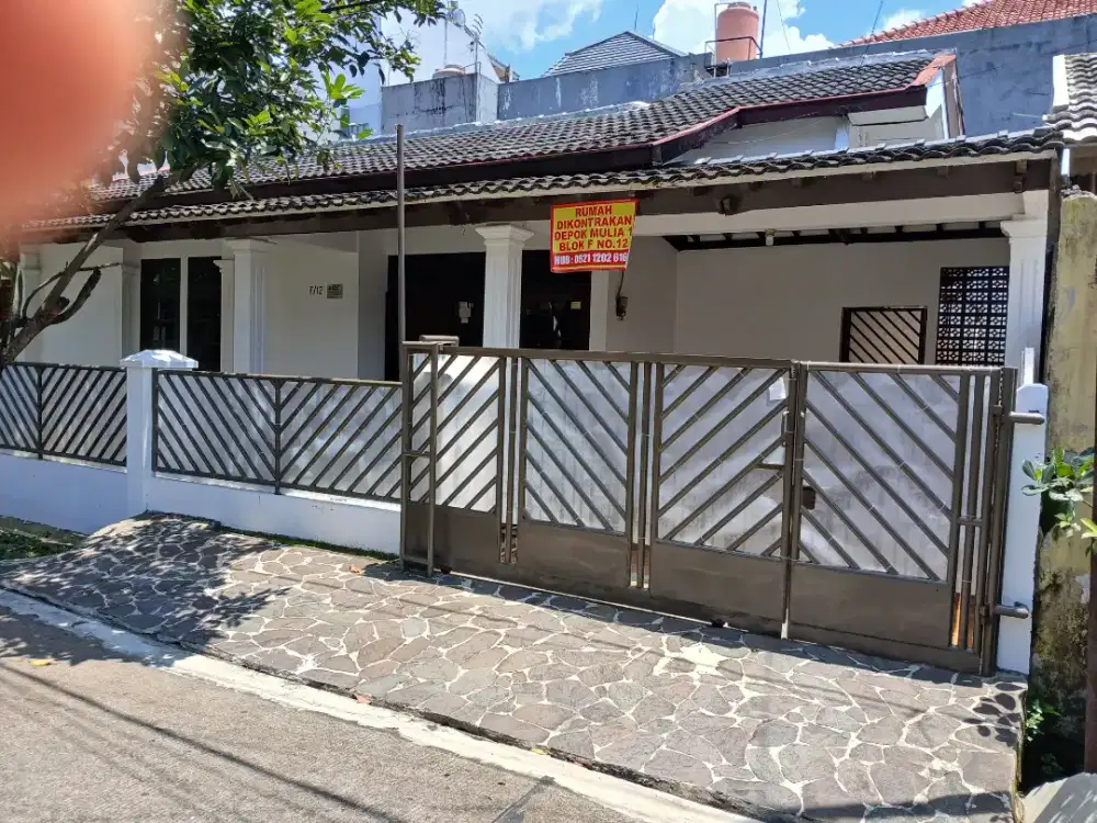 Dikontarakan Rumah berlokasi perum mulya 1 dengan halaman bergarasi