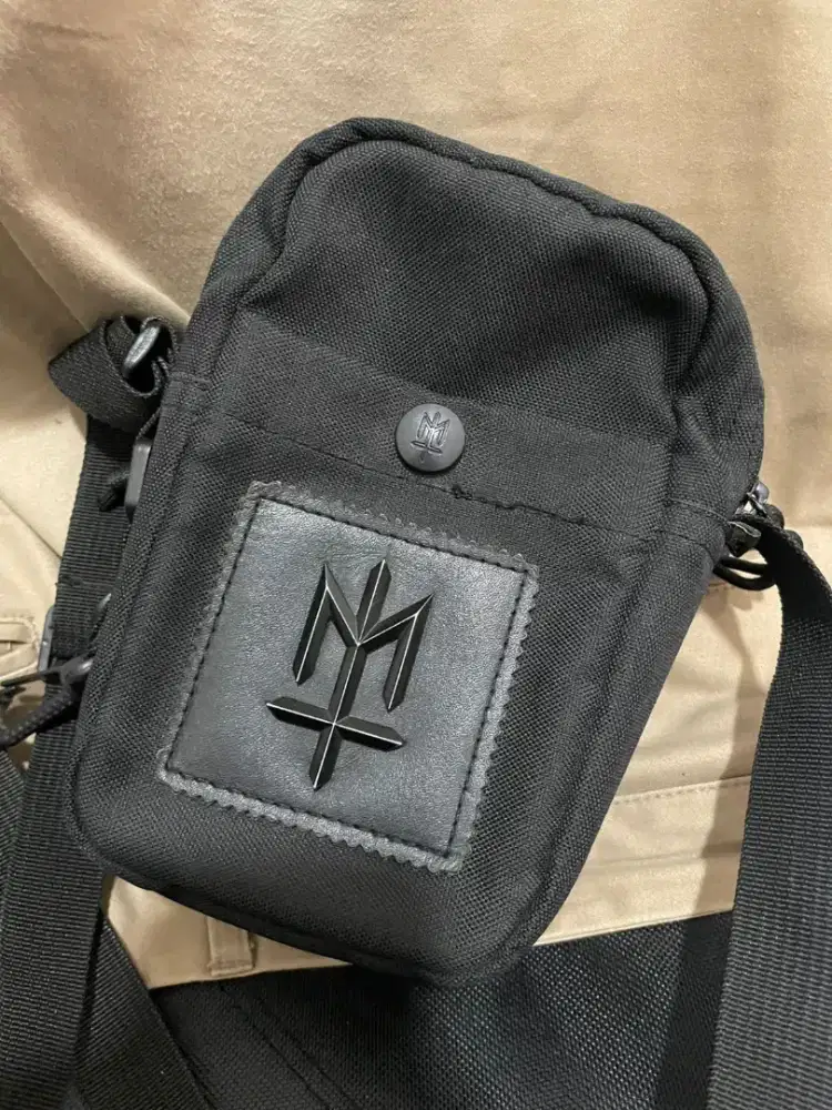 MATERNAL mini sling bag