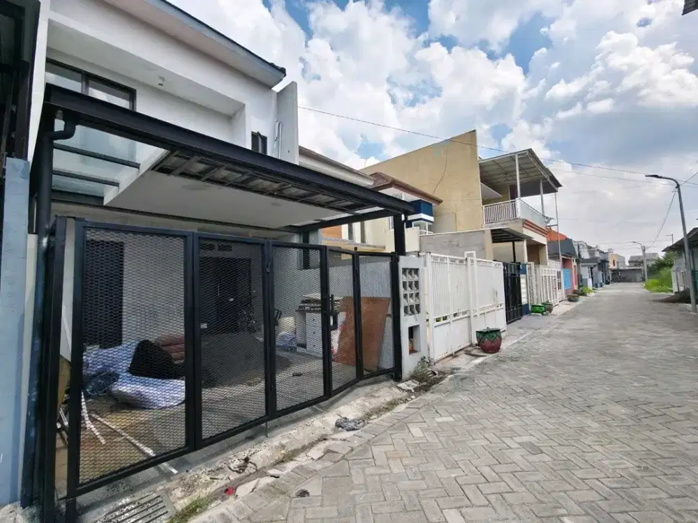 RUMAH 2 Lantai di jalan MODERN