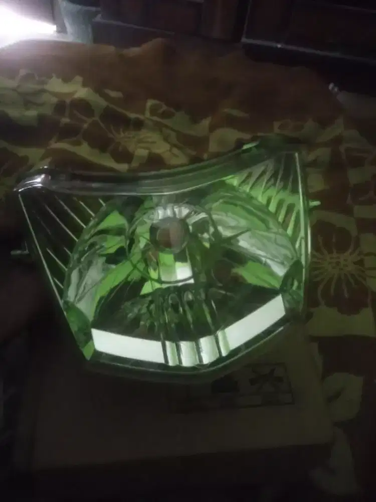Dudukan lampu depan Supra fit new