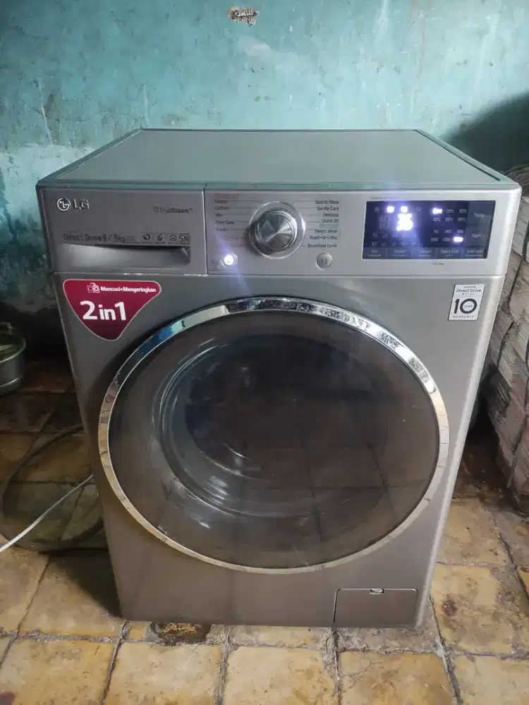 Mesin cuci front loading LG 9 KG wash and dry