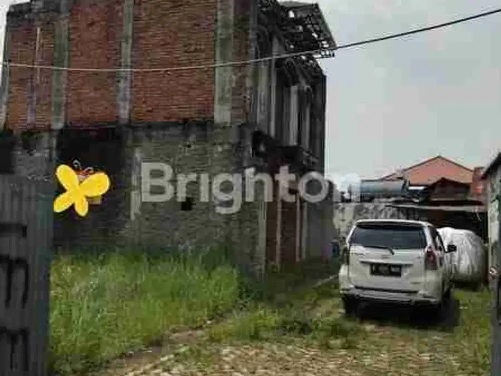 Dijual sebidang tanah dengan luas 312 m² yang didalamnya sudah terdapat bangunan rumah 2 lantai besar baru aelesai 50%, cocok untuk investasi dan usaha kos kosan