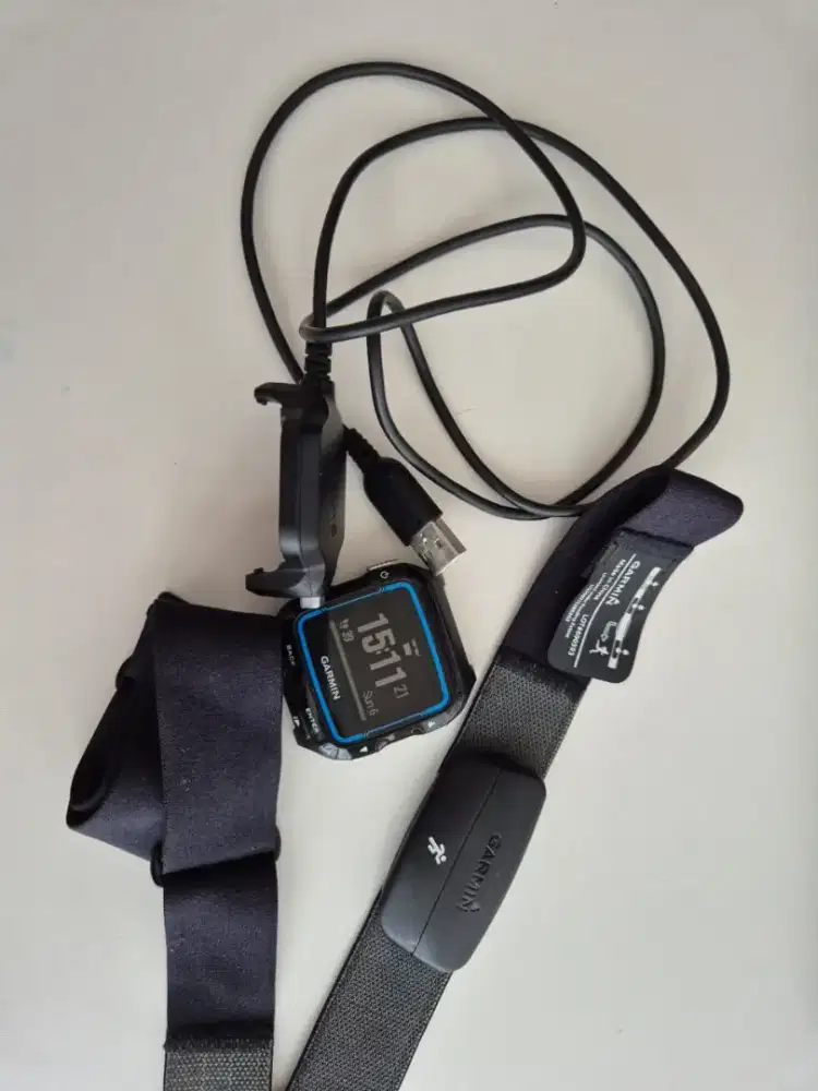 Garmin Forerunner 920XT w/ charger and body strap. No arm strap