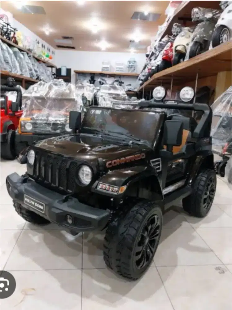 Mobil Aki Jeep Commando sudah ban karet,jok kulit,anti kejut,garansi
