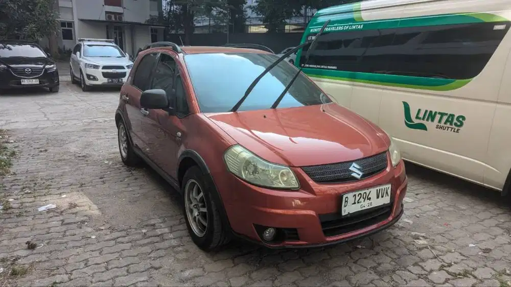 Dijual Suzuki SX4 tahun 2007 Automatic warna Orange kondisi siap pakai