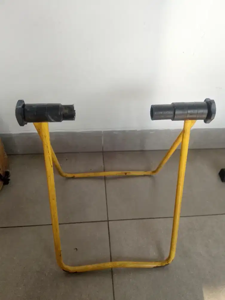 paddock standar sepeda warna kuning