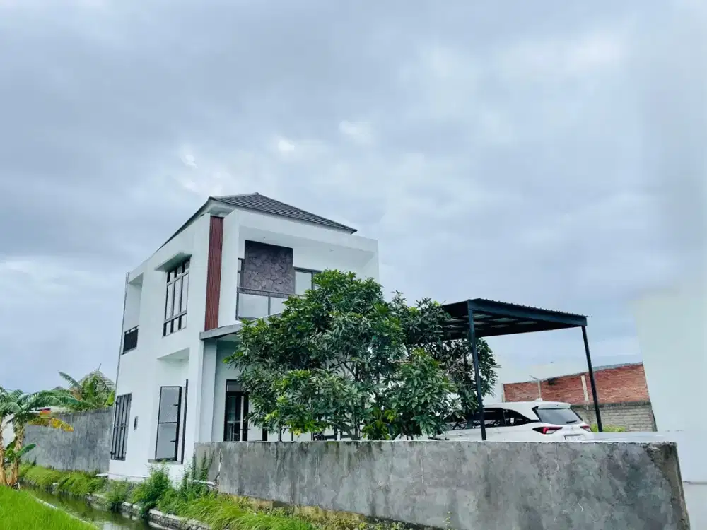 Rumah modern minimalis pinggir jalan view sawah di kota Mataram