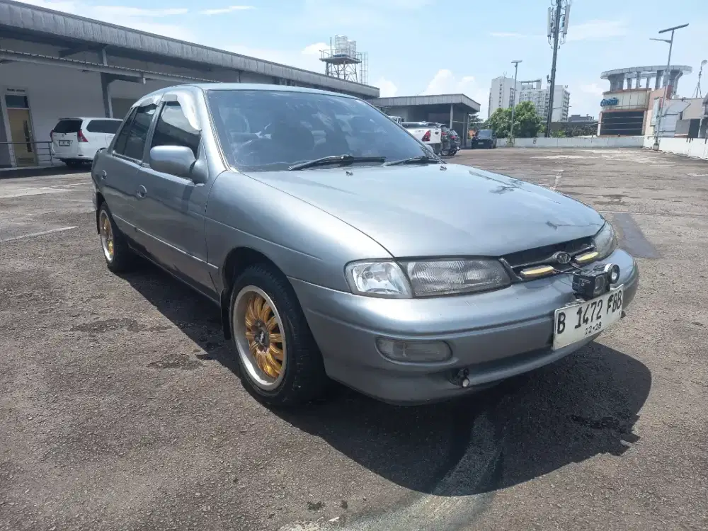 Kia timor DOHC M/T ABU ABU 1,5cc