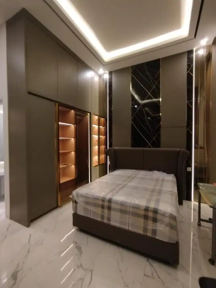 Almari, dipan, dan backdrop tv minimalis