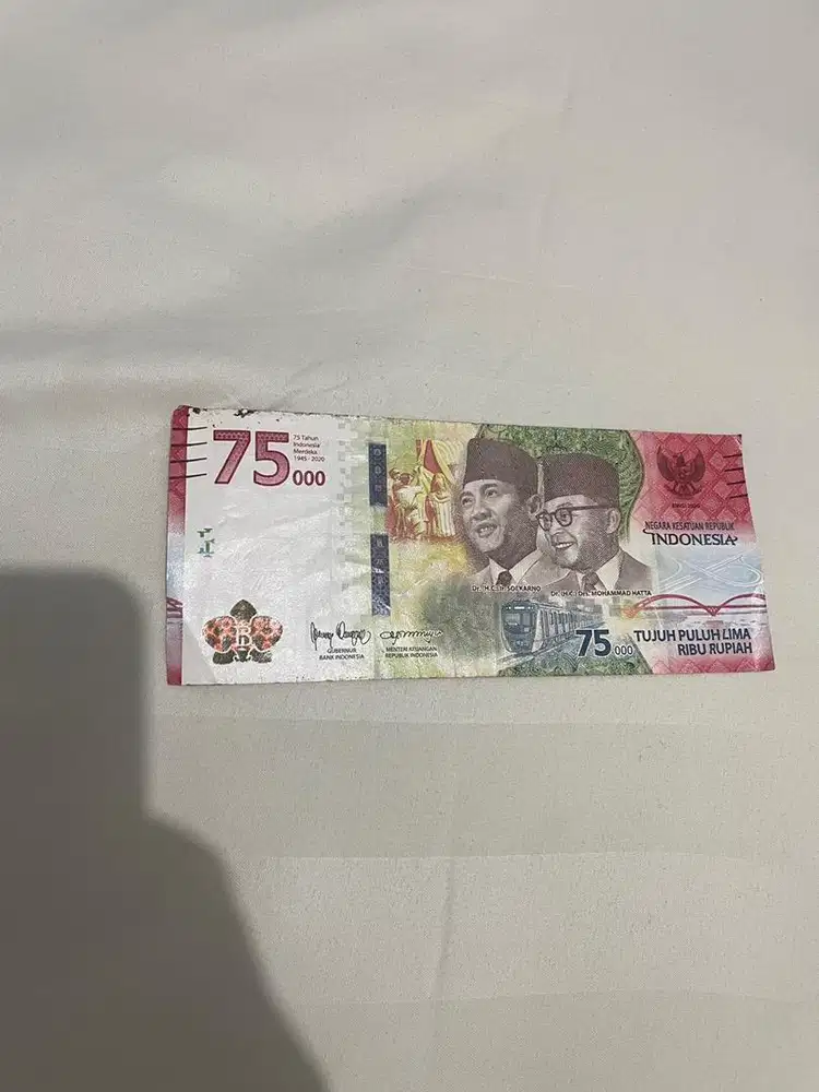 Uang 75 ribu bekas