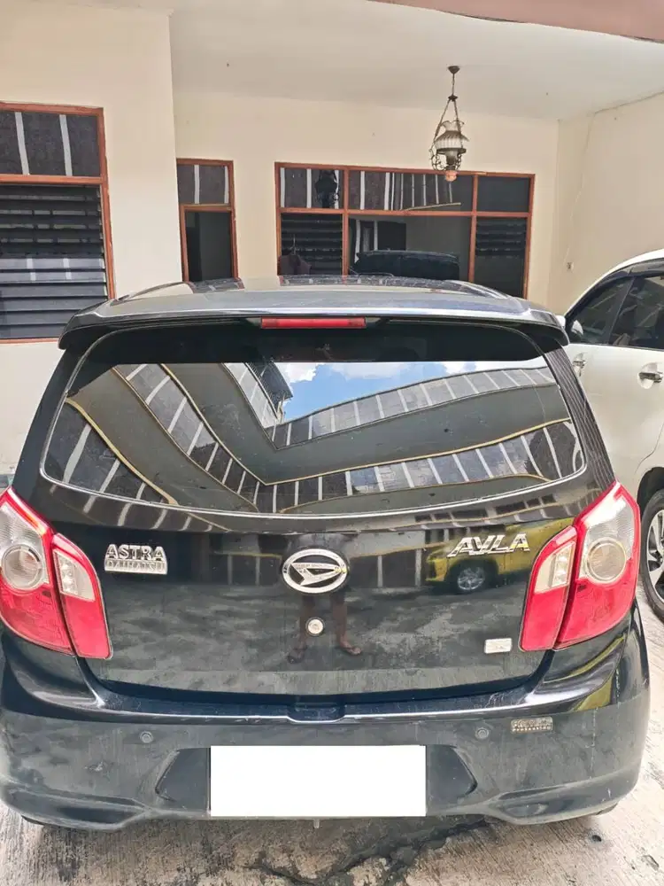 AYLA 2014 Hitam tipe X Bensin 1:25 Luar Kota - 1:17 Dalam Kota