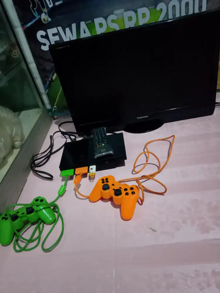 Tv led tosiba dan PS 2 komplit sesuai gambar Rp.2jt nego