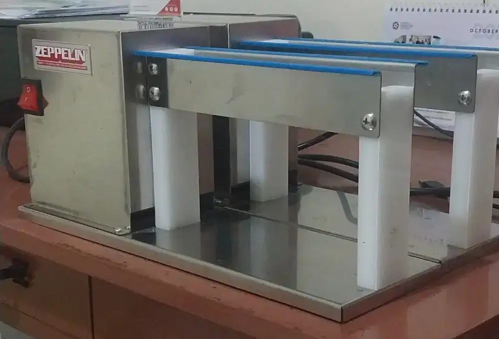 Mesin kupas telur puyuh