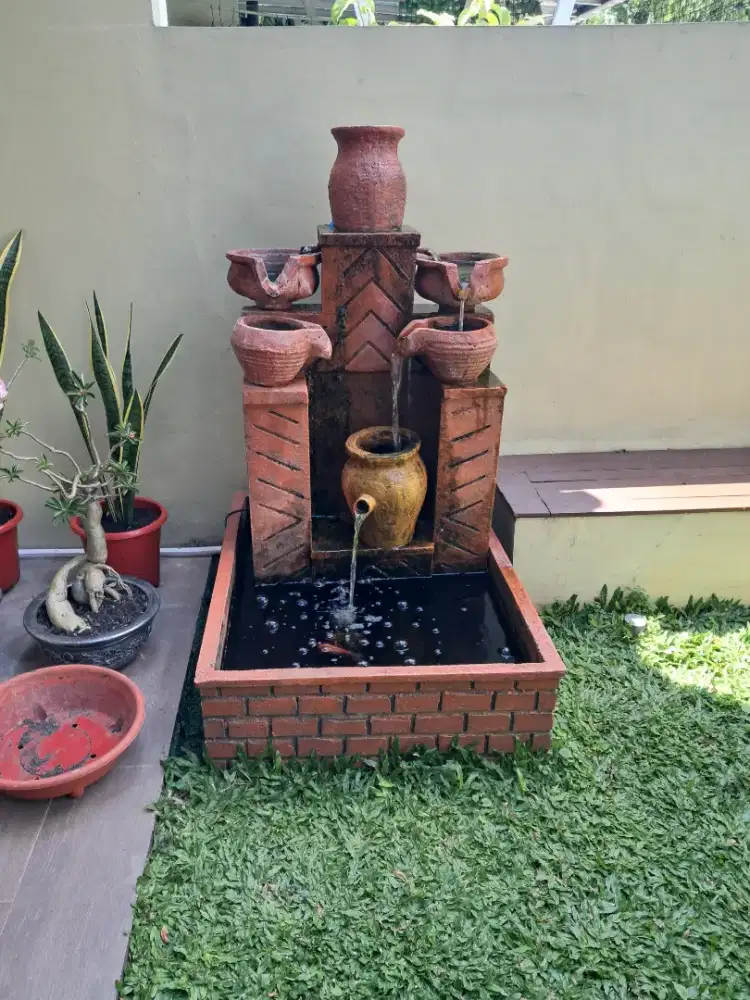 Relief air mancur tiga susun