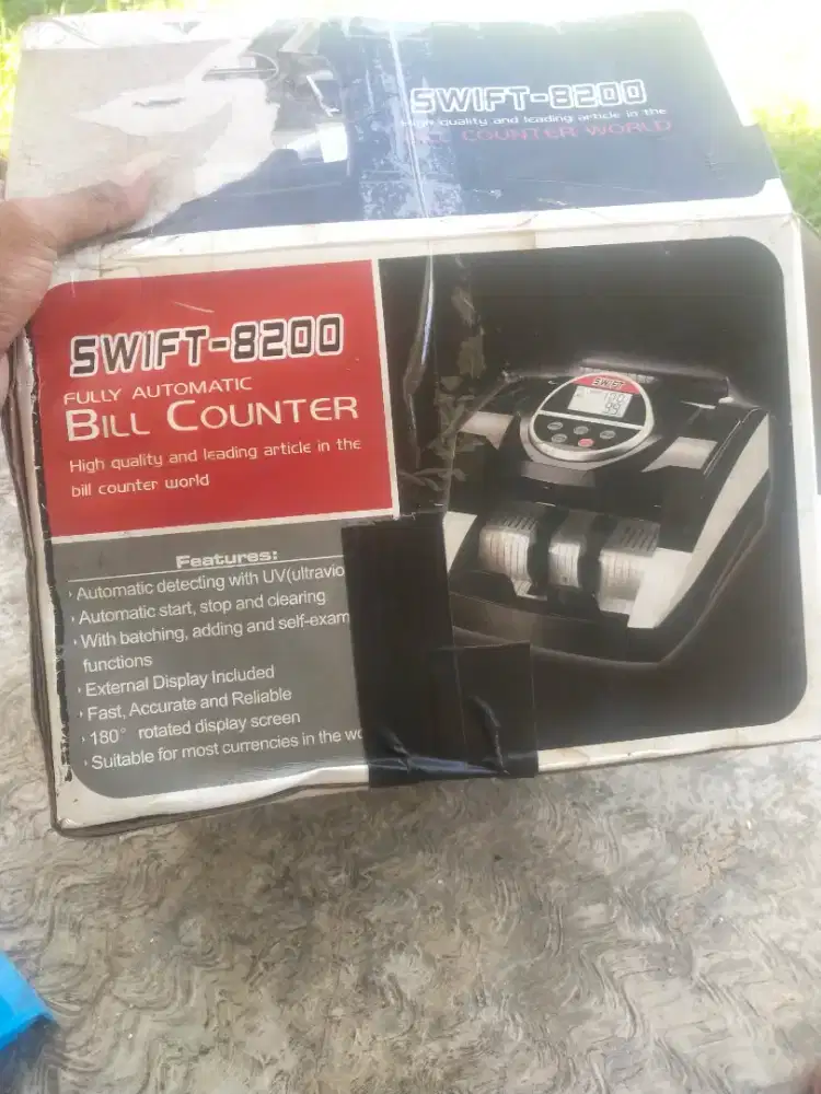 Mesin hitung uang dan pendeteksi uang palsu