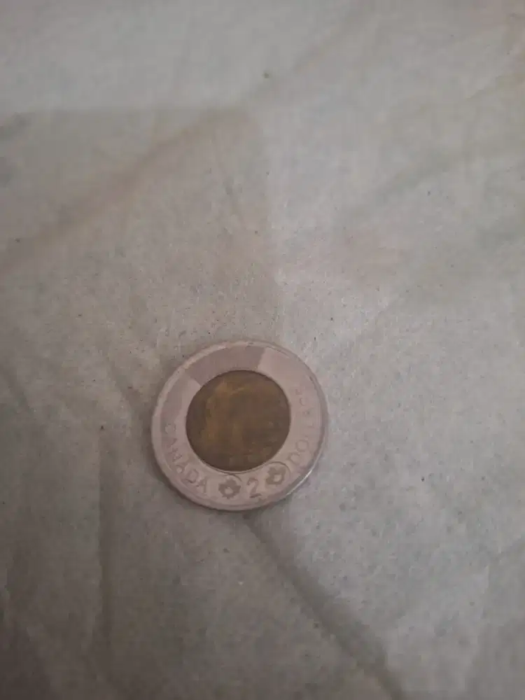 Koin 2 dollar atau tonnie 
Koin asli dari canada 
Limited edition 
Bar