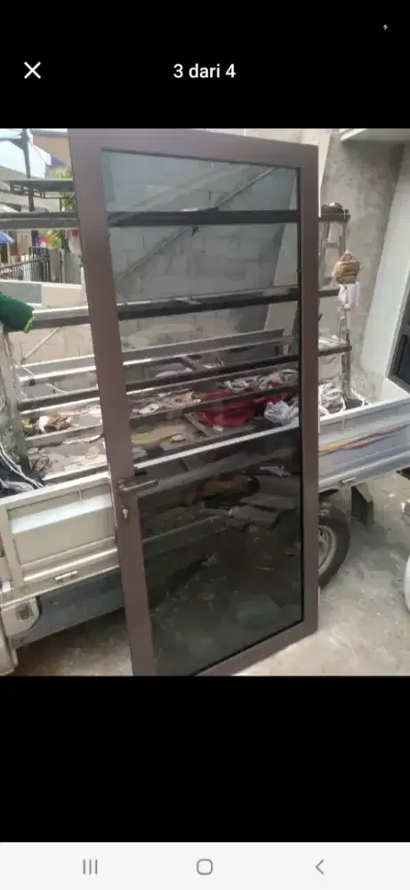 Pintu kaca alumunium swing T220cm L100cm hrg 2,3 jt / unit terpasang