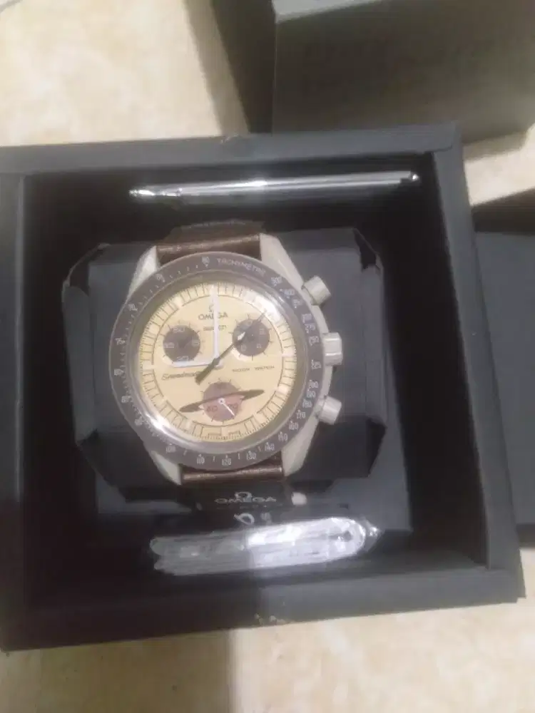 Swatch Omega 
Speedmaster Moon To Saturn
