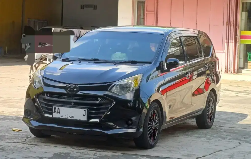 Sigra 1.2 Deluxe Matic