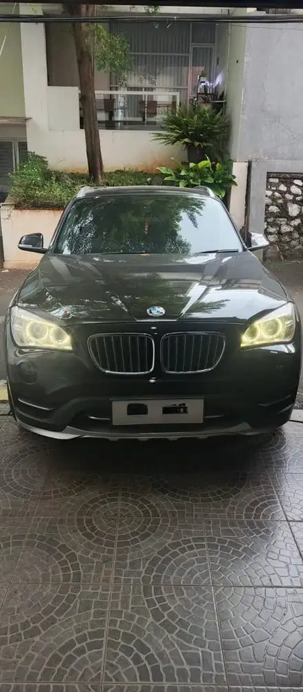 BMW X1 2.0xDrive18i xLine Executive Bensin AT 2014 Brown Metalik