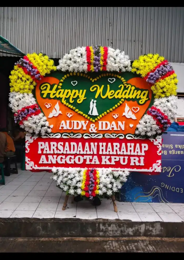 Karangan bunga papan pernikahan