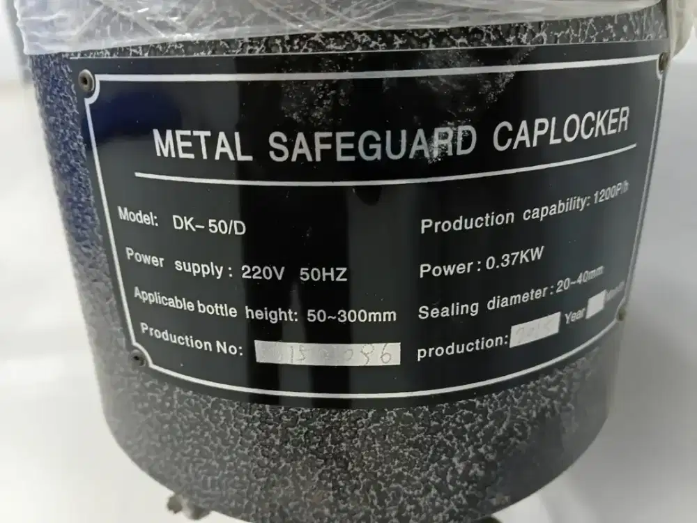 Mesin pemasang tutup botol