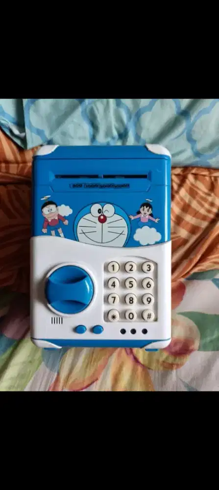 Dijual mainan Mesin ATM Musik Lagu Celengan Doraemon.