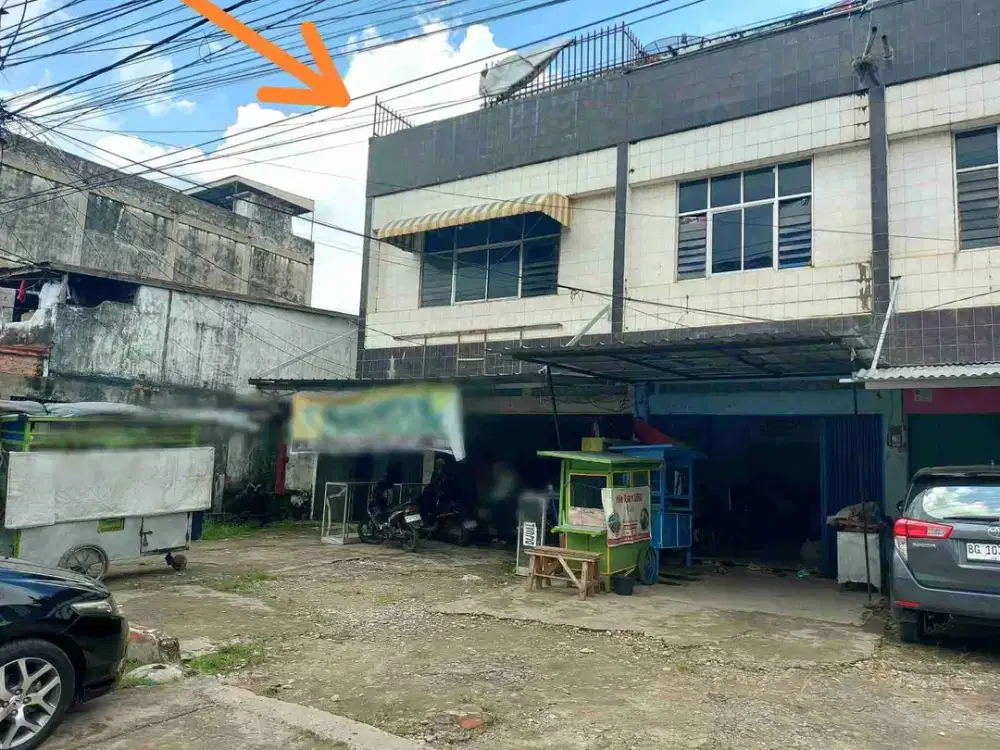 Dijual ruko plus rumah degan tanah luas di pinggir jalan Kuto Batu Palembang