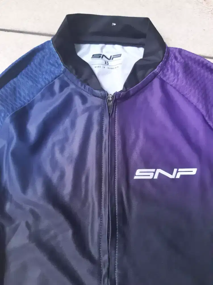 Baju bersepeda merek SNP
