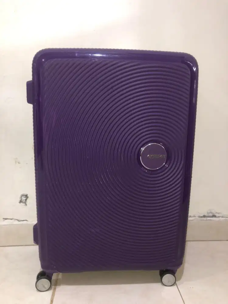 koper bekas american tourister