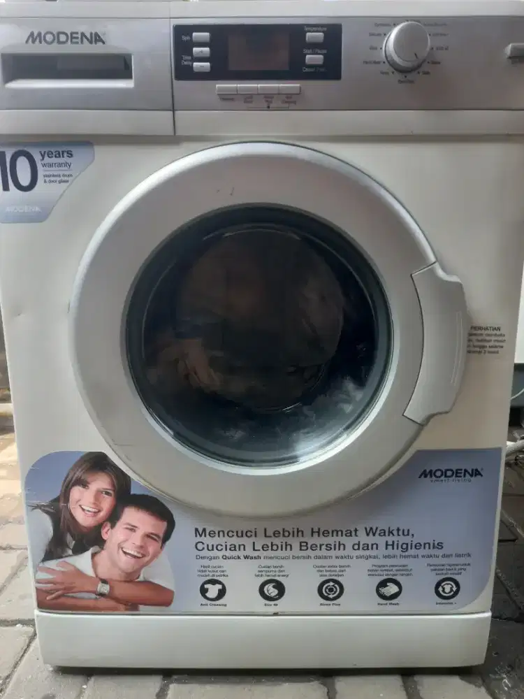 Mesin cuci modena front loading minus segitiga