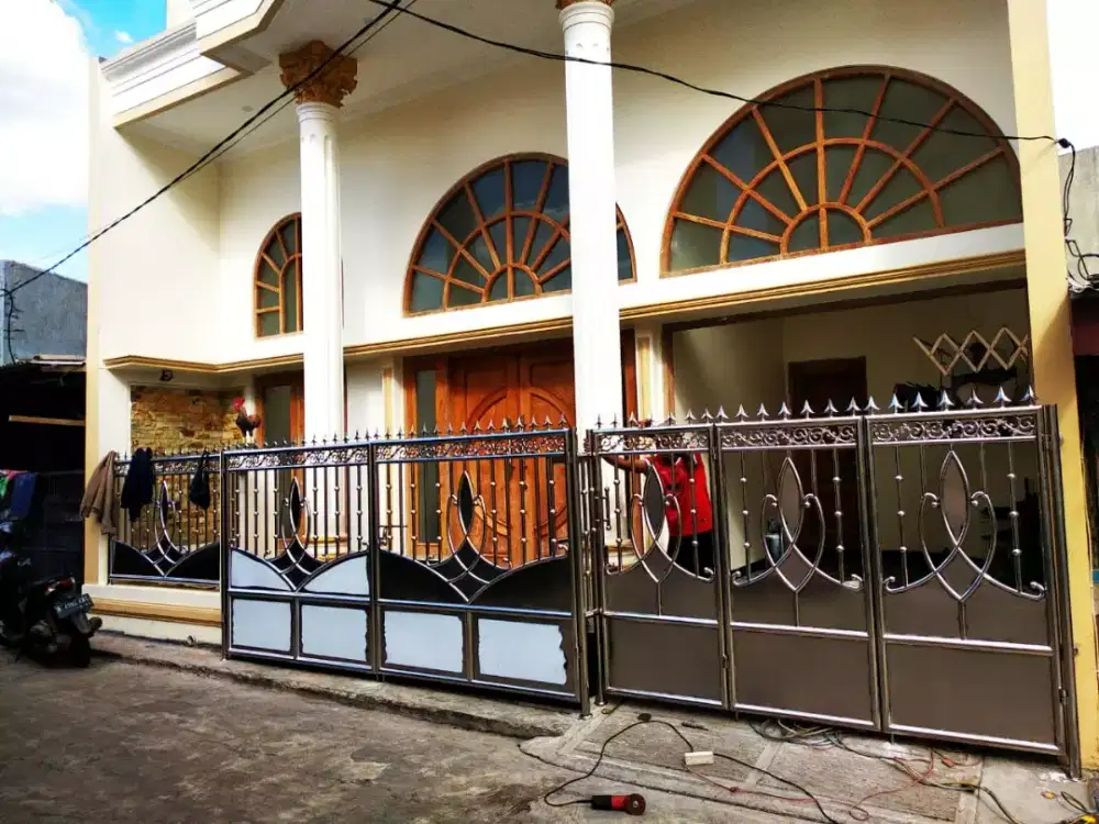 Pintu garasi stainlis motif tulip