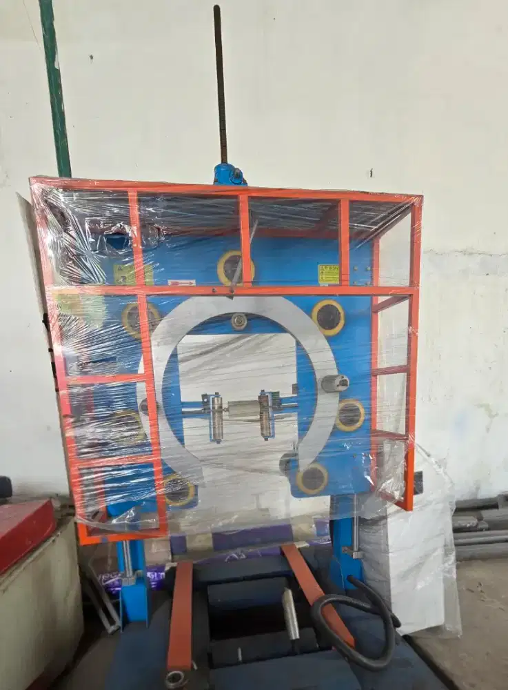 Mesin Pembungkus Koil Vertikal (Vertical Coil Wrapping Machine)