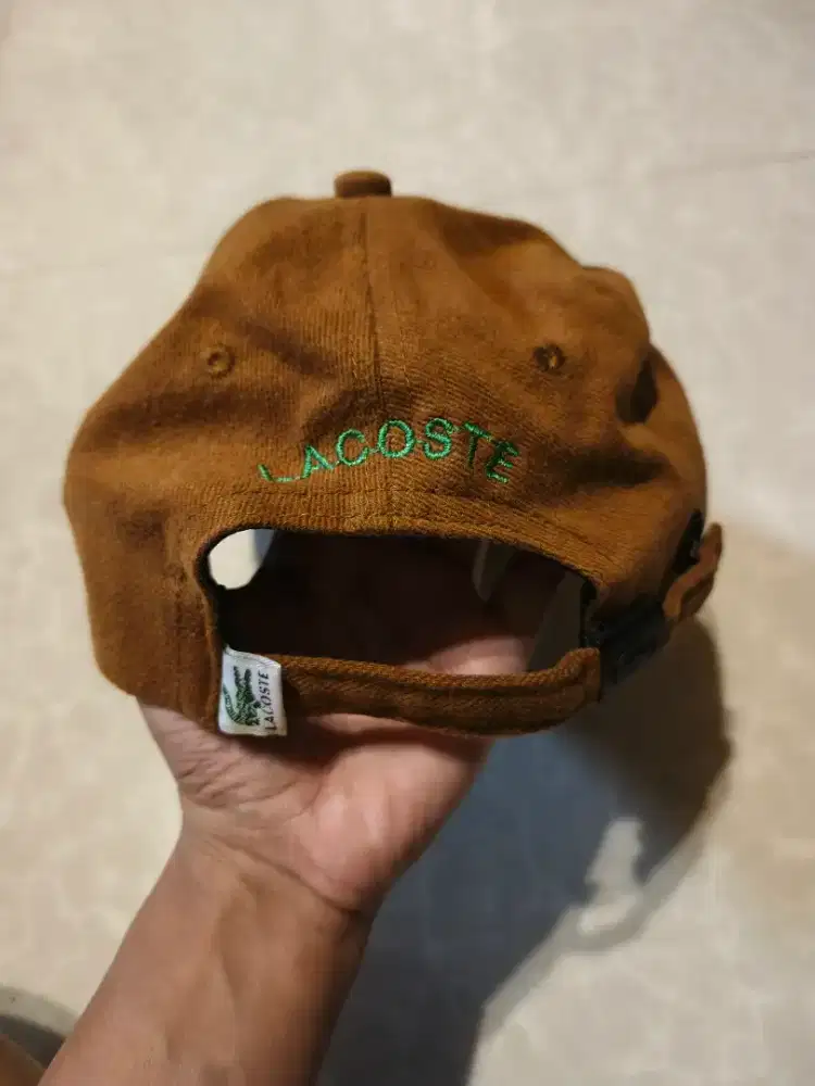 topi lacoste coklat ori
