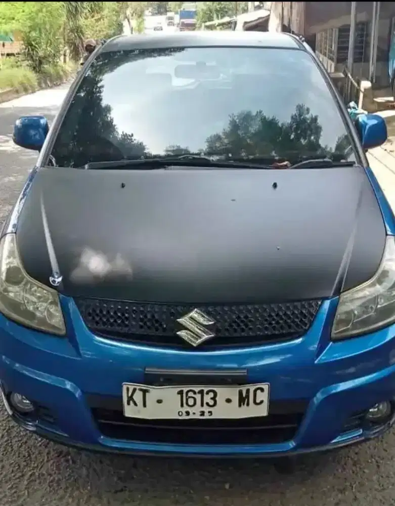 Suzuki x over manual tahun 2010