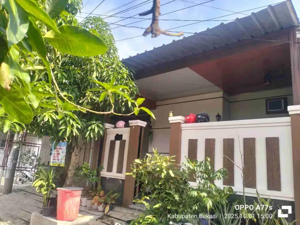 rumah 1,5 lantai siap huni,bebas banjir harga murah dibawah pasar di karang satria,green residence,karang satria,bekasi