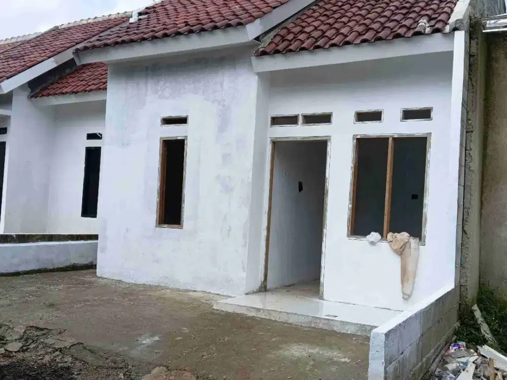 RUMAH MINIMALIS DALAM PERUMAHAN BEBAS BANJIR
