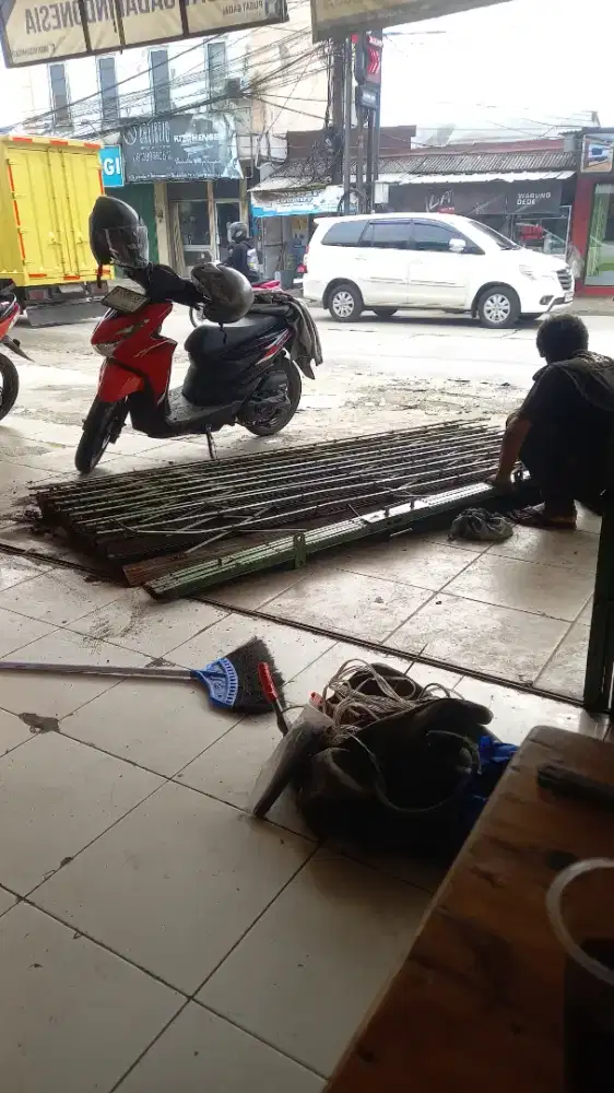 Tukang reparasi service rolling door folding gate