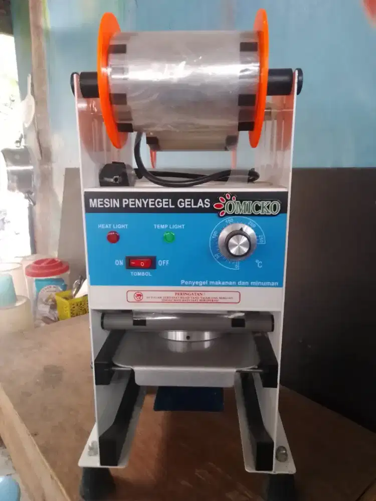 mesin press minuman merk omicko