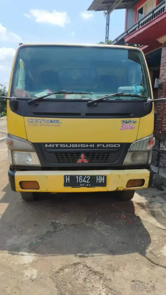 Mitsubishi 125 ps super speed dump truk tahun 2010