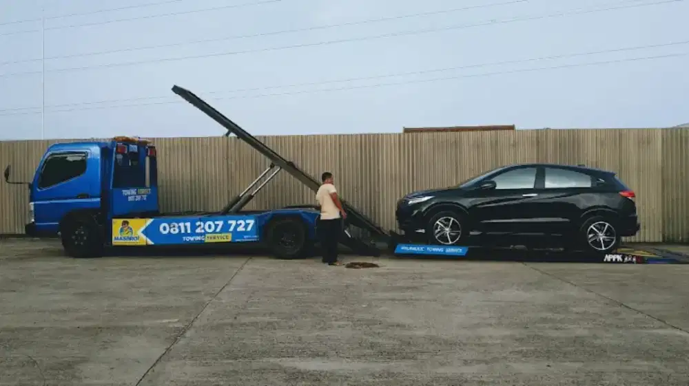 Jasa towing full hidrolik 24 jam