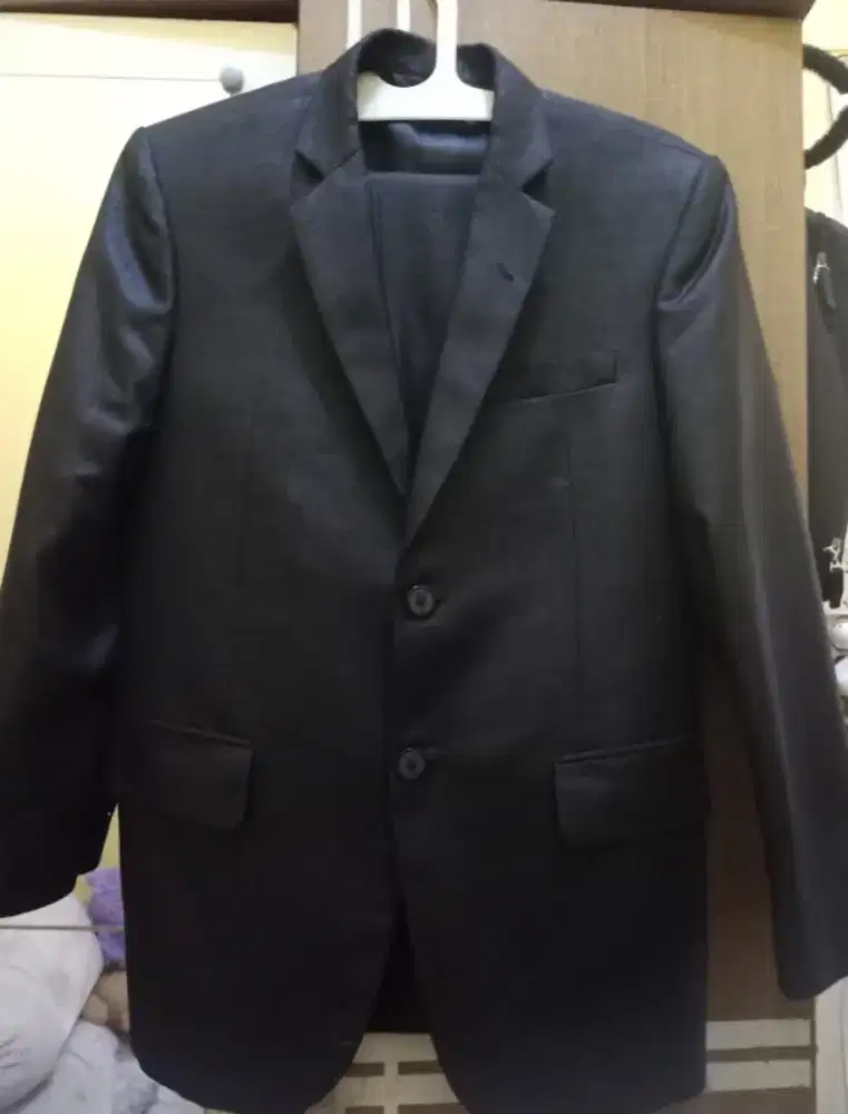 Stelan jas jahit di butik
