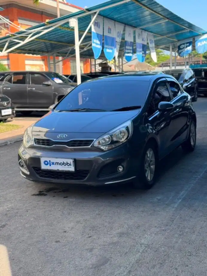 Kia Rio 1.4 SE Bensin AT 2012 Abu Abu