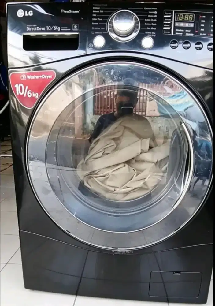 Mesin cuci X APARTMEN warna mewah hitam ,merek LG sudah inverter hemat