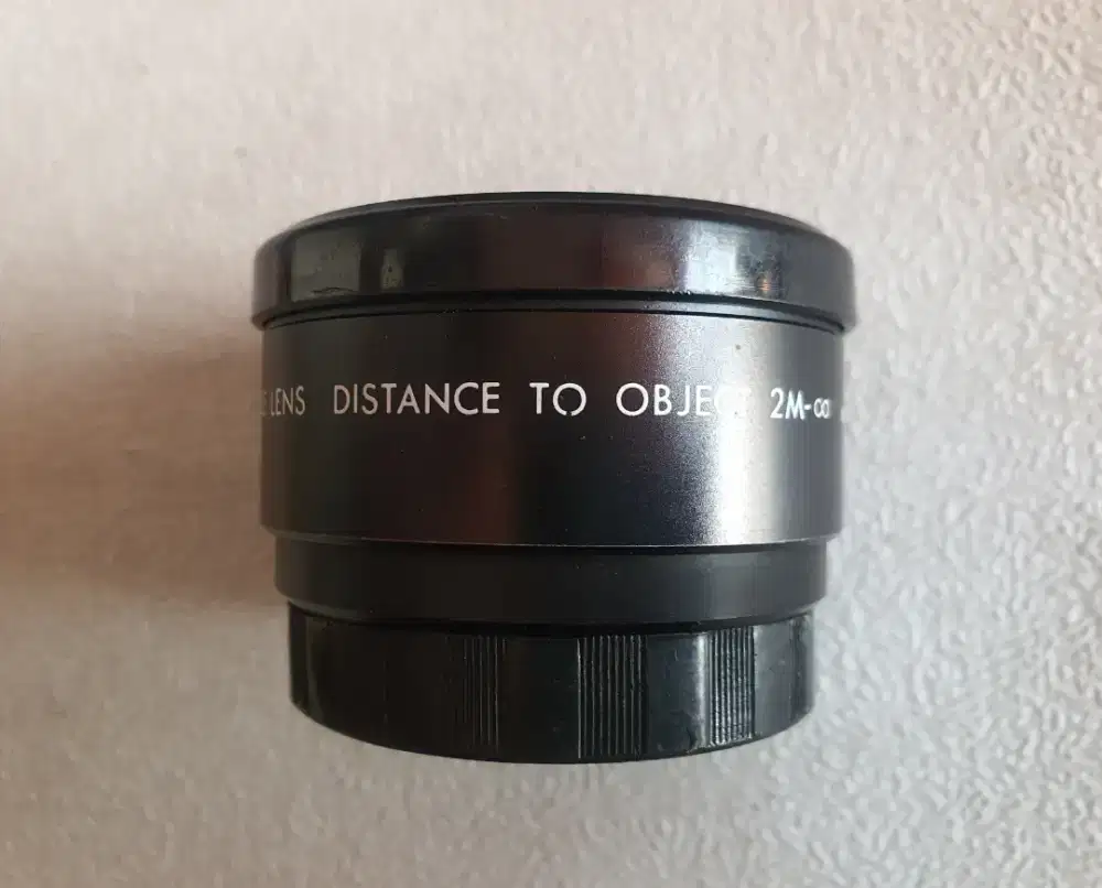 lensa tambahan (auxiliary lens) merek Samigon dengan fokus telephoto